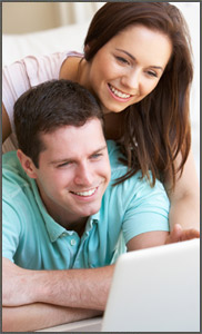 smiling-couple-on-computer-dT-17068522_Couple.jpg